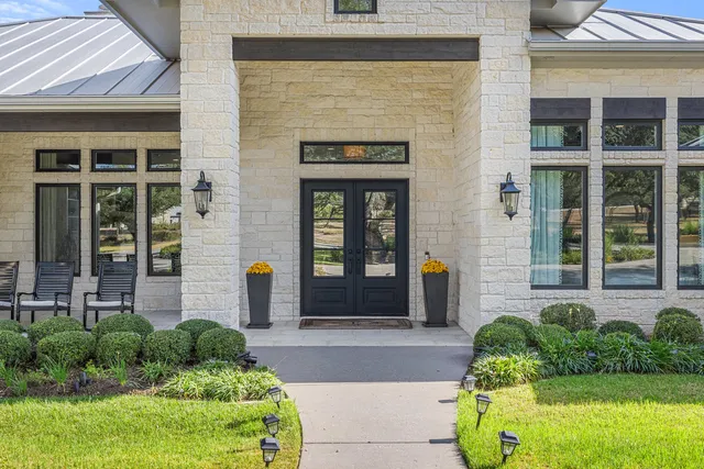 a front view of a house with garden