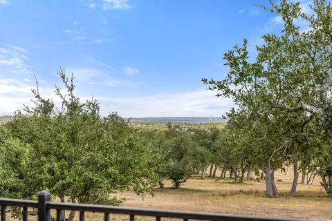a kitchen with stainless steel appliances granite countertop lots of counter top space and wooden floor