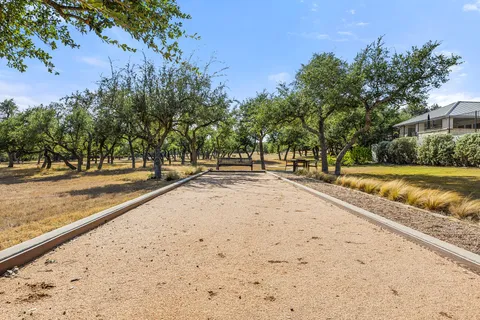 a bedroom with two beds and a large window