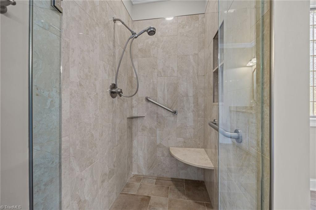 2000 Muirfield Court Elon, NC 27244 - Photo 22 of 43 Updated Zero Entrance Shower in Primary Bath w/ grab bars and seat.