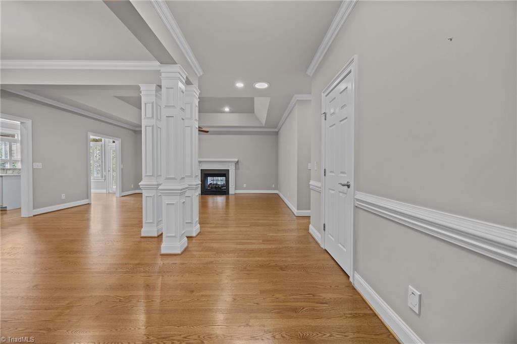 2000 Muirfield Court Elon, NC 27244 - Photo 4 of 43 Come on in! Dining Area on the Left, Living Room with double sided Fireplace to the Sunroom/Den and Kitchen & Breakfast Rm on the Left.