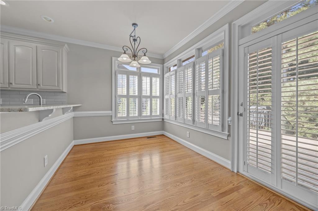 2000 Muirfield Court Elon, NC 27244 - Photo 10 of 43 Breakfast area (13x10) w/ Plantation Shutters and doors leading to the Patio.