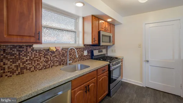 a kitchen with a sink and a window