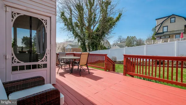 a view of a patio with a table and chairs