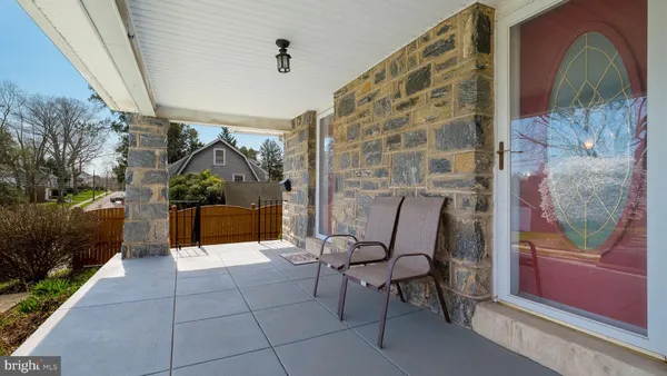 a view of a chairs and table in backyard