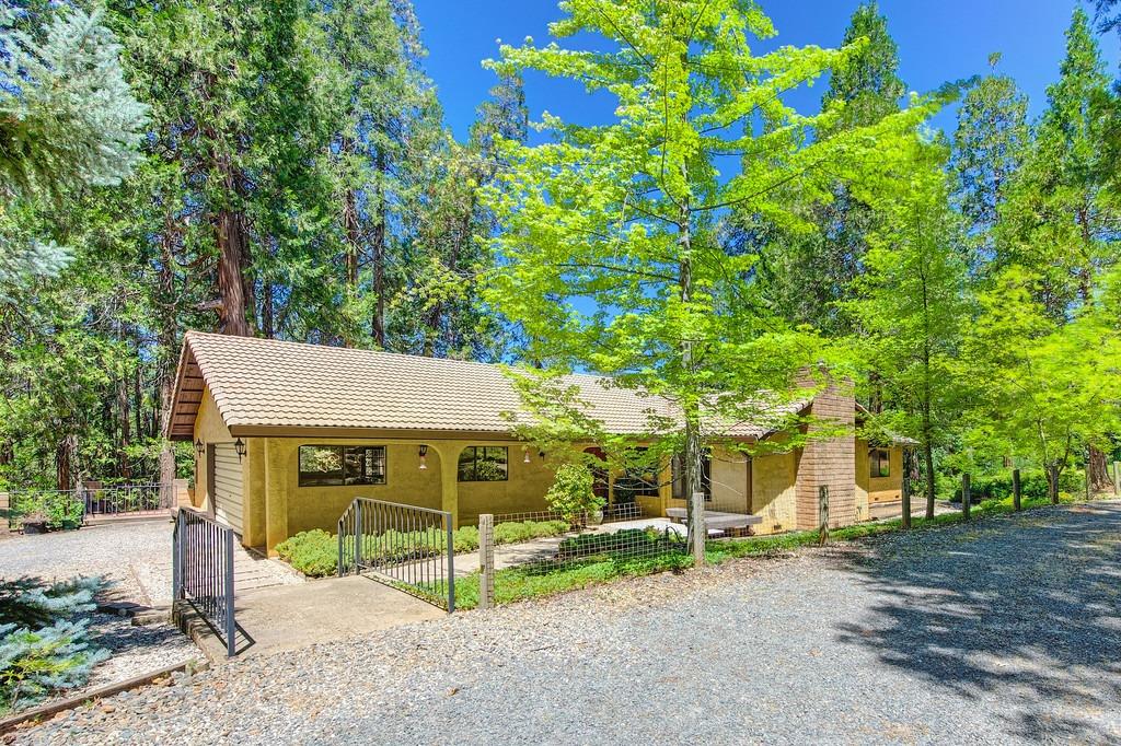 26145 Green Acres Road Colfax, CA 95713 - Photo 1 of 1 a view of a house with garden and sitting area