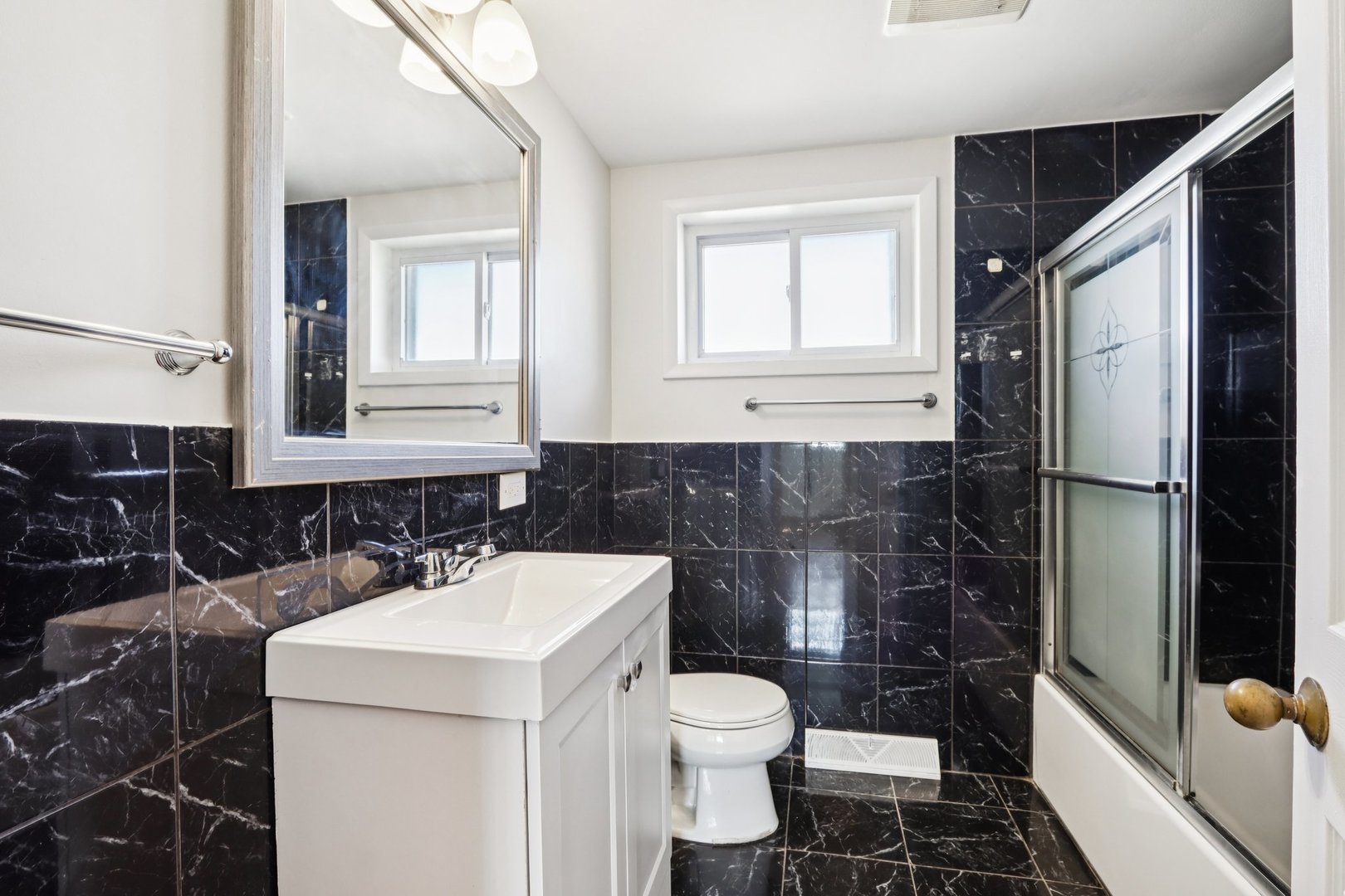 8666 Gregory Lane, Unit C Des Plaines, IL 60016 - Photo 12 of 30 a bathroom with a sink toilet and shower