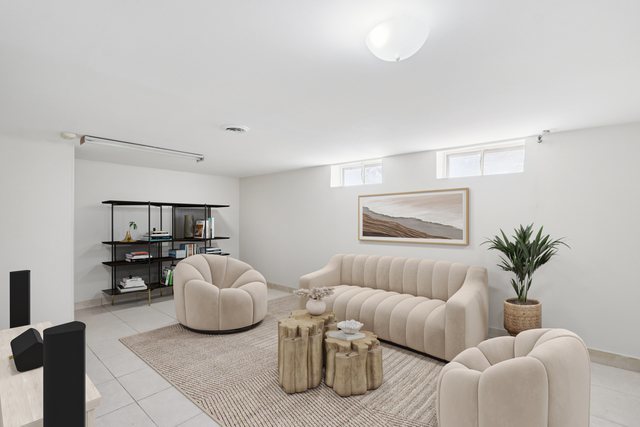 8666 Gregory Lane, Unit C Des Plaines, IL 60016 - Photo 17 of 30 a living room with furniture and a potted plant