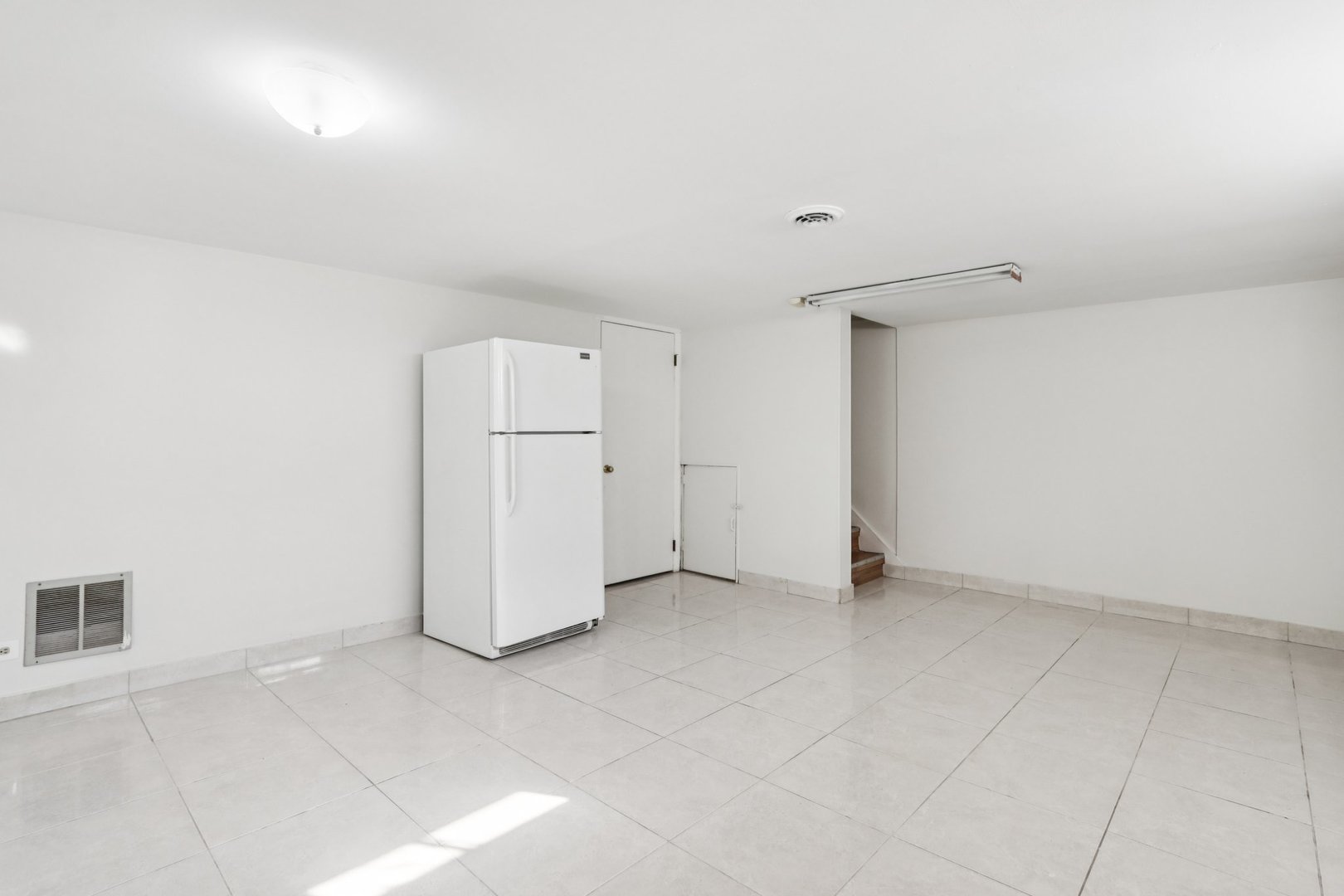 8666 Gregory Lane, Unit C Des Plaines, IL 60016 - Photo 19 of 30 an empty room with a empty space and windows