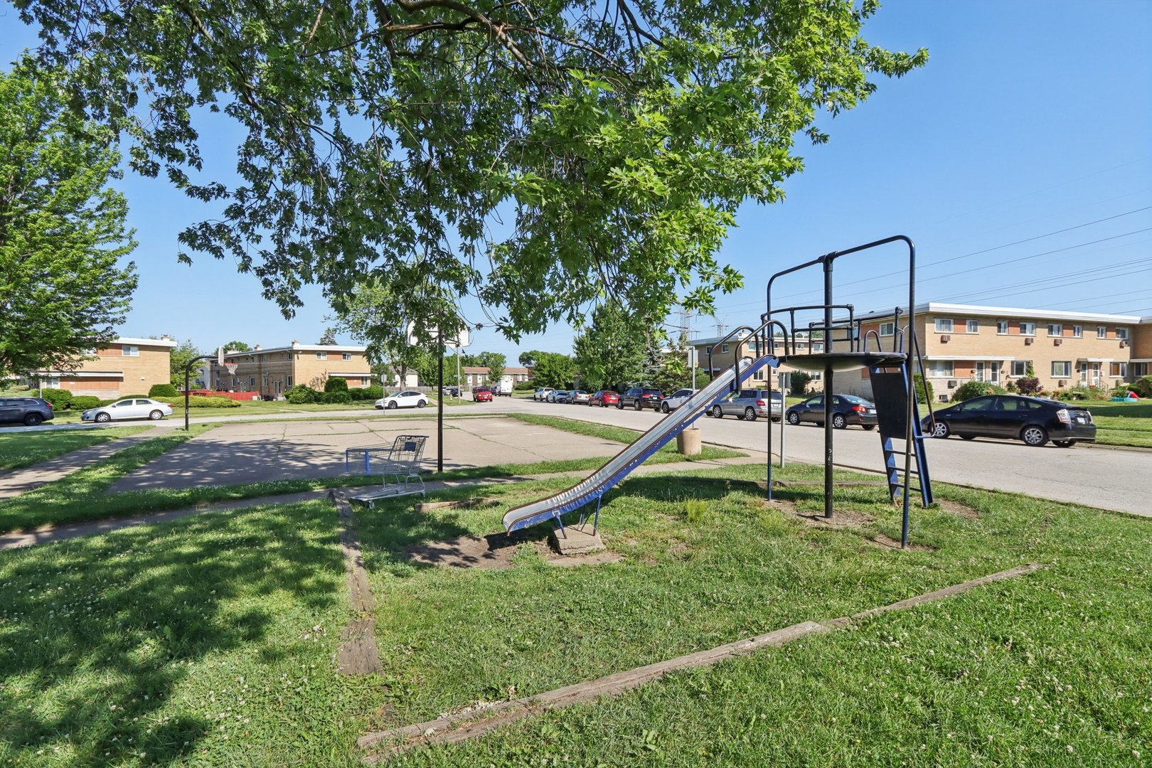 8666 Gregory Lane, Unit C Des Plaines, IL 60016 - Photo 26 of 30 a swimming pool with lots of tress in front of it