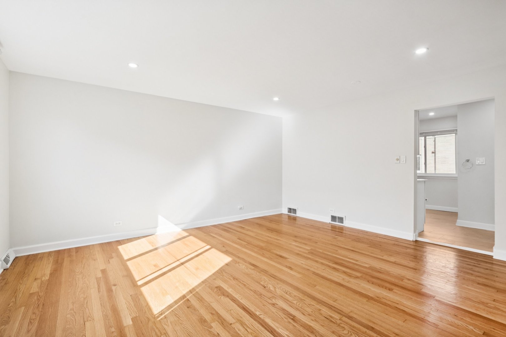 8666 Gregory Lane, Unit C Des Plaines, IL 60016 - Photo 5 of 30 a view of an empty room and wooden floor