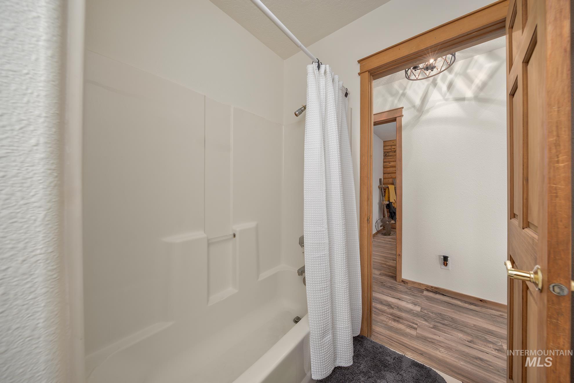 1855 Jones Road Weiser, ID 83672 - Photo 20 of 33 Bathroom featuring shower / bath combination with curtain