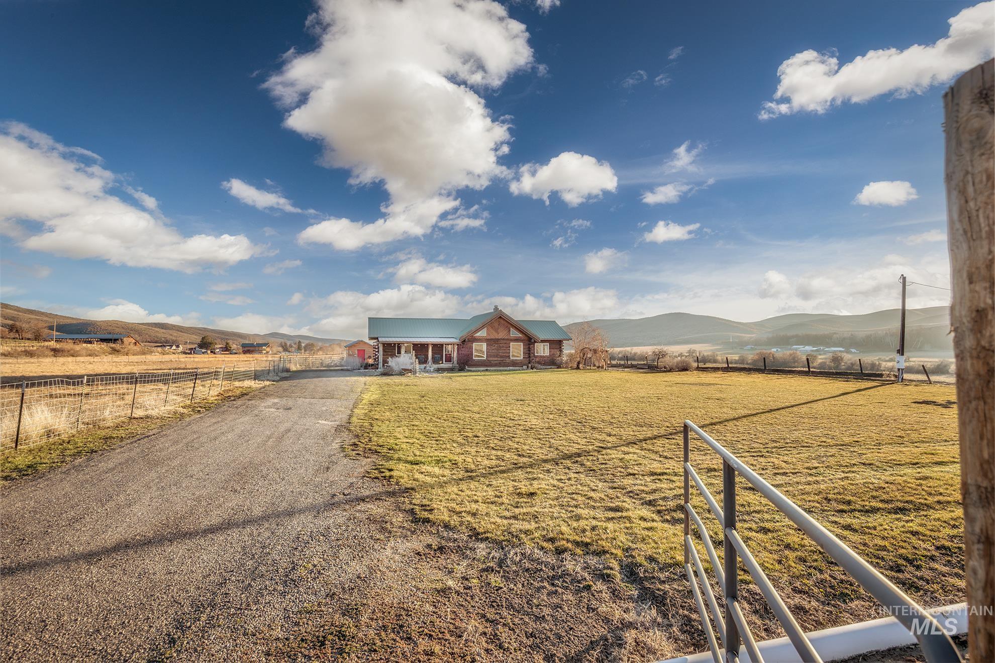 1855 Jones Road Weiser, ID 83672 - Photo 23 of 33 View of front of home with a mountain view, a view of countryside, and a metal roof