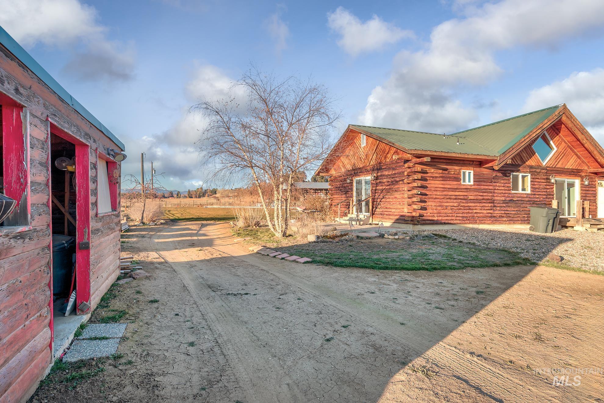1855 Jones Road Weiser, ID 83672 - Photo 25 of 33 View of side of property featuring a metal roof and log exterior