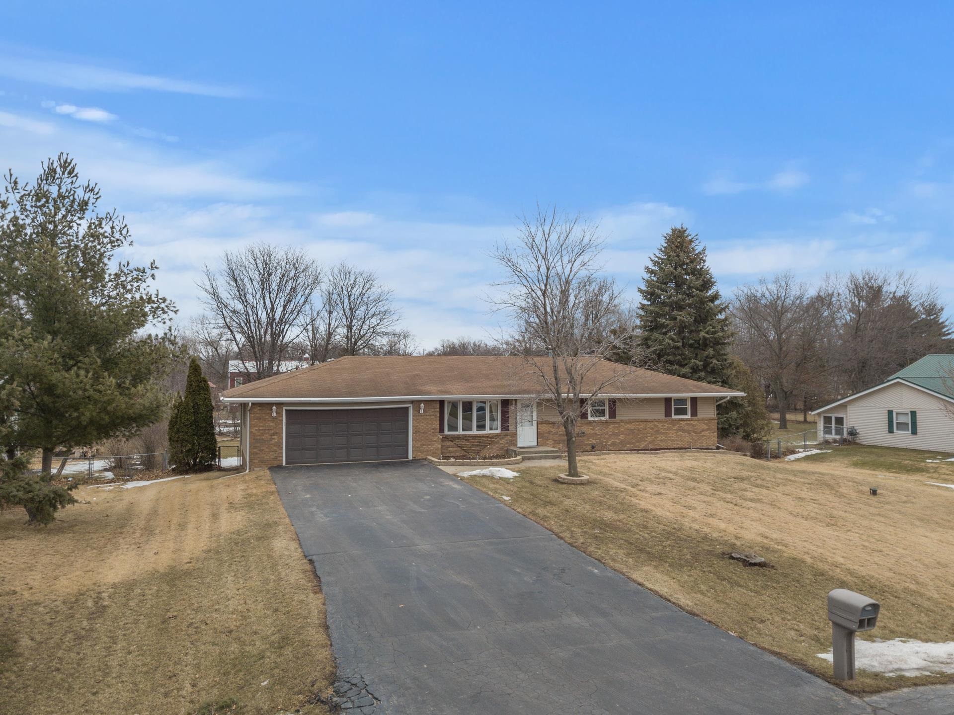4082 Valerie Road Roscoe, IL 61073 - Photo 3 of 38 a view of house with yard and trees in the background