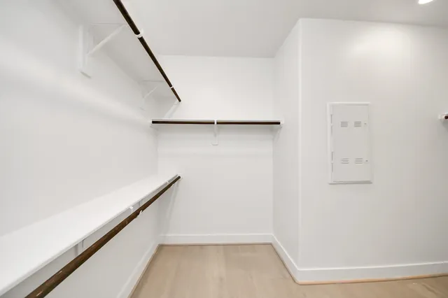 a spacious bathroom with a double vanity sink mirror and shower