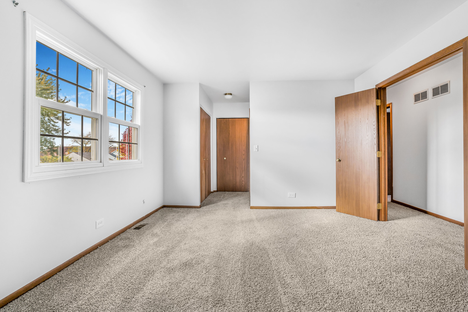1388 Bow String Court Carol Stream, IL 60188 - Photo 12 of 24 a view of an empty room with a window