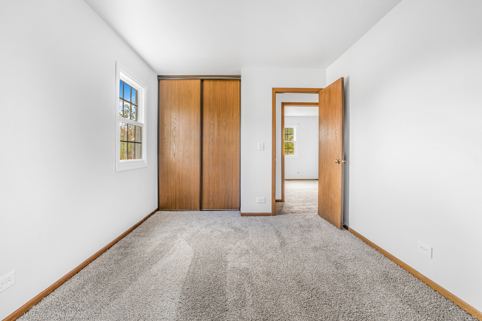 1388 Bow String Court Carol Stream, IL 60188 - Photo 18 of 24 a view of an empty room with closet and a window