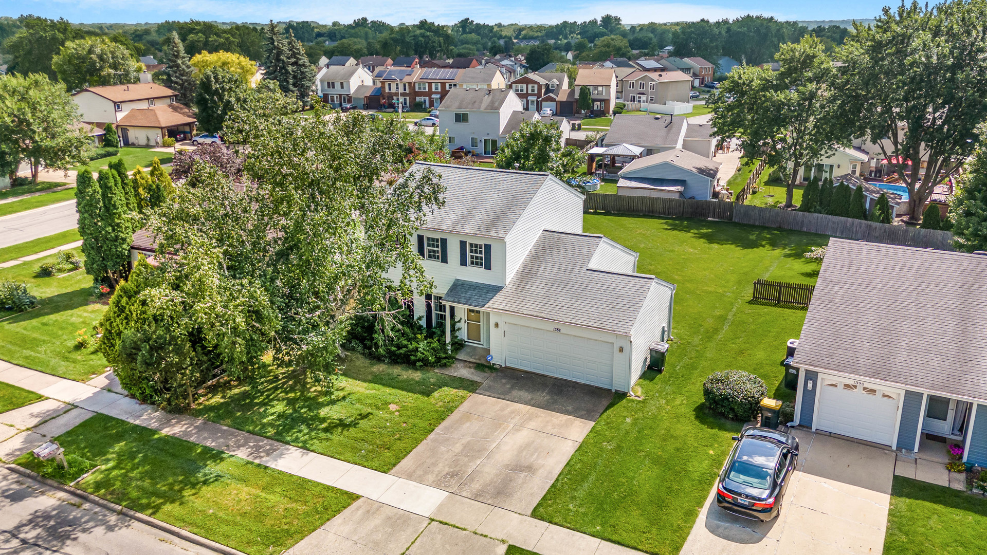 1388 Bow String Court Carol Stream, IL 60188 - Photo 2 of 24 an aerial view of a house with garden space and street view