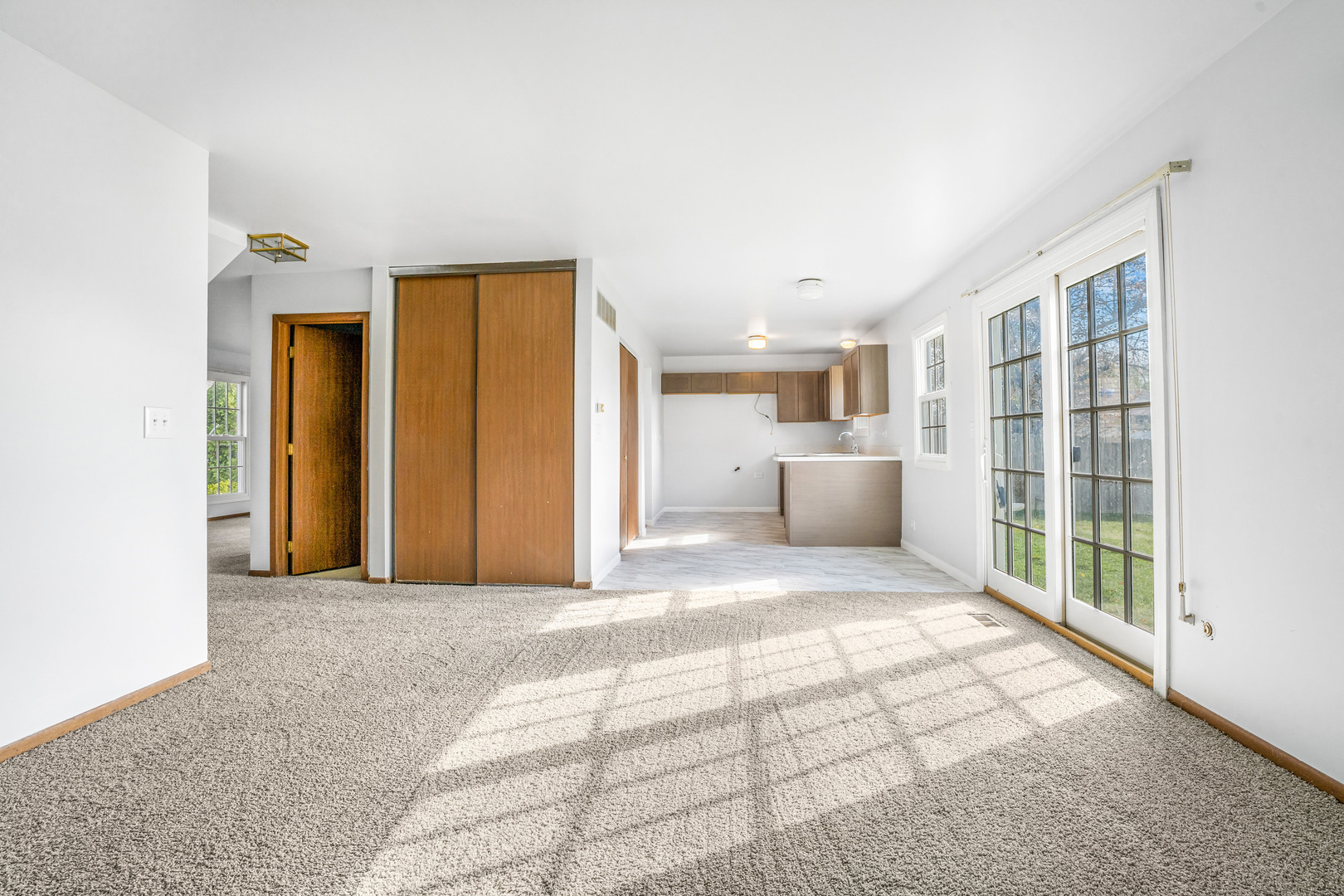 1388 Bow String Court Carol Stream, IL 60188 - Photo 7 of 24 a view of an empty room with a window