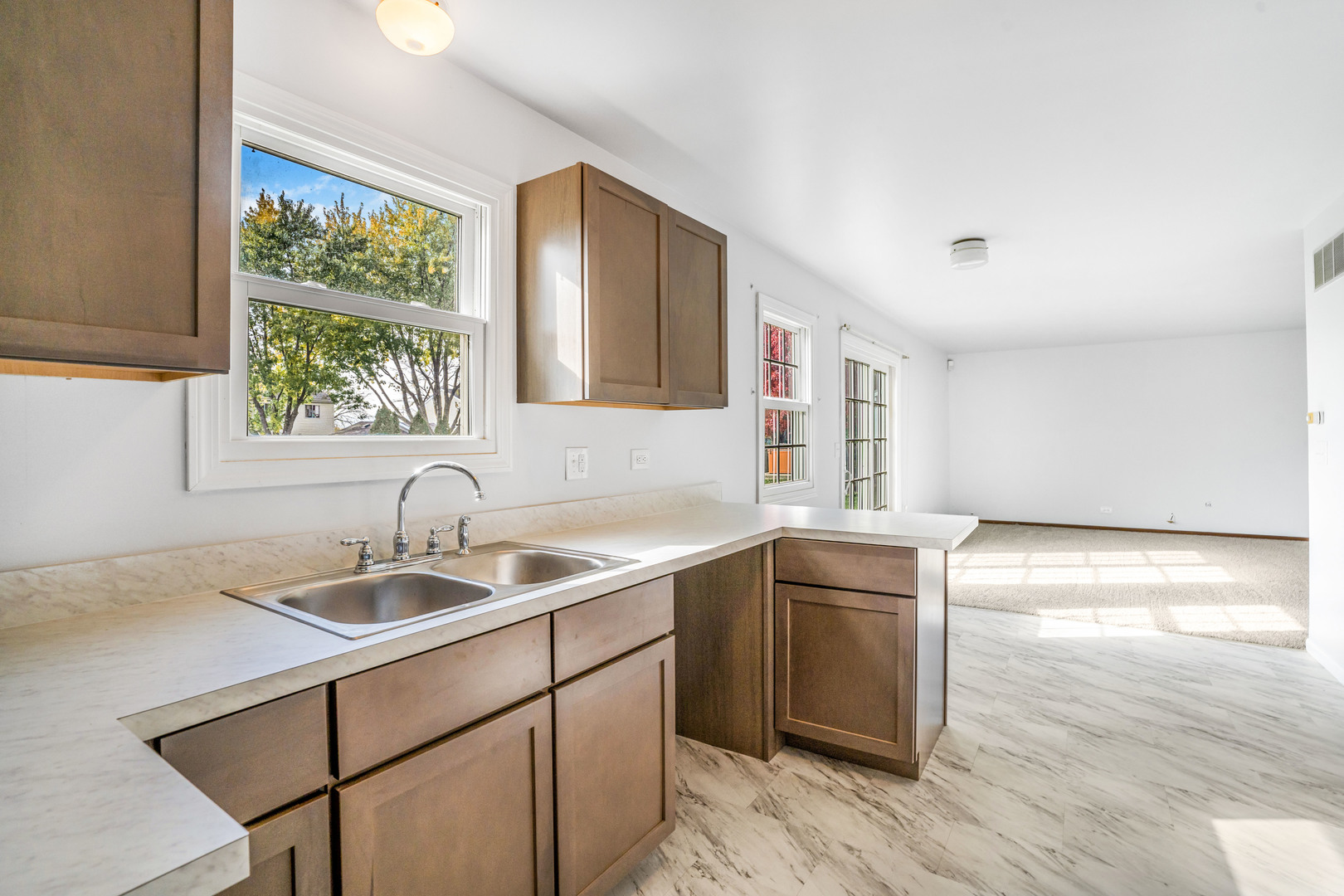 1388 Bow String Court Carol Stream, IL 60188 - Photo 9 of 24 a kitchen with a sink and cabinets