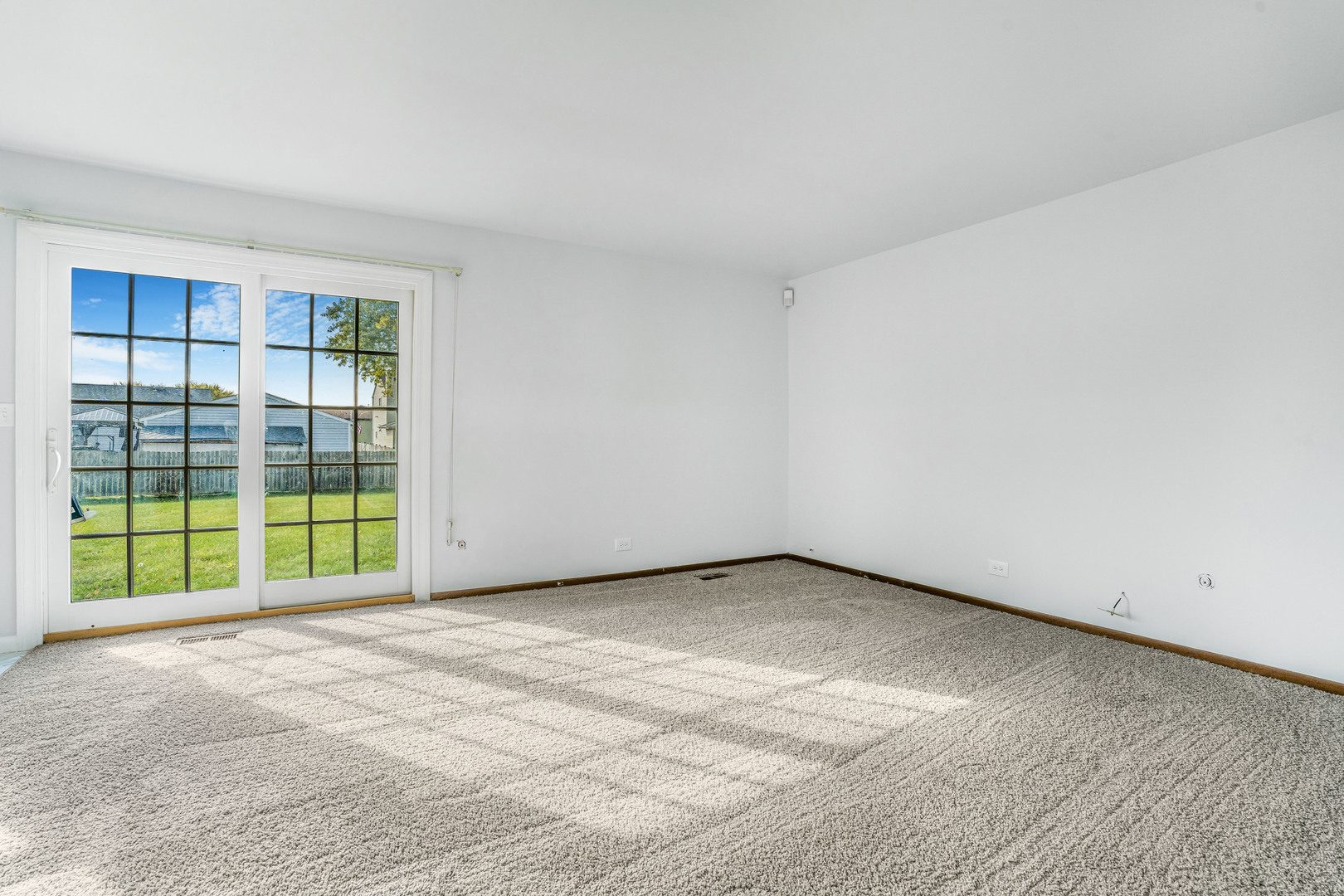 1388 Bow String Court Carol Stream, IL 60188 - Photo 10 of 24 a view of an empty room with a window