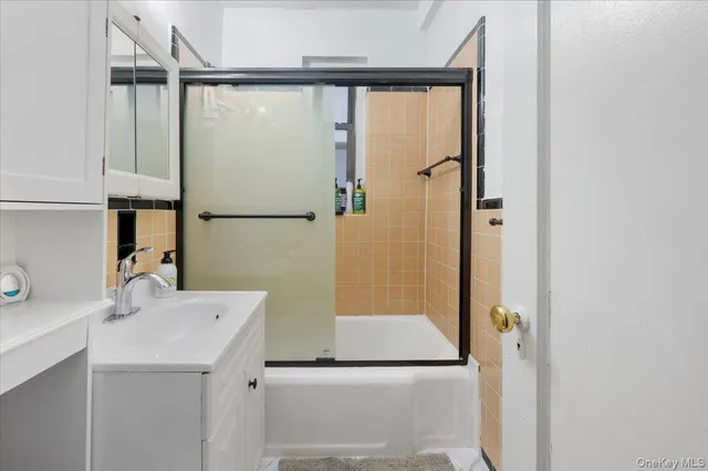 a bathroom with a sink and mirror