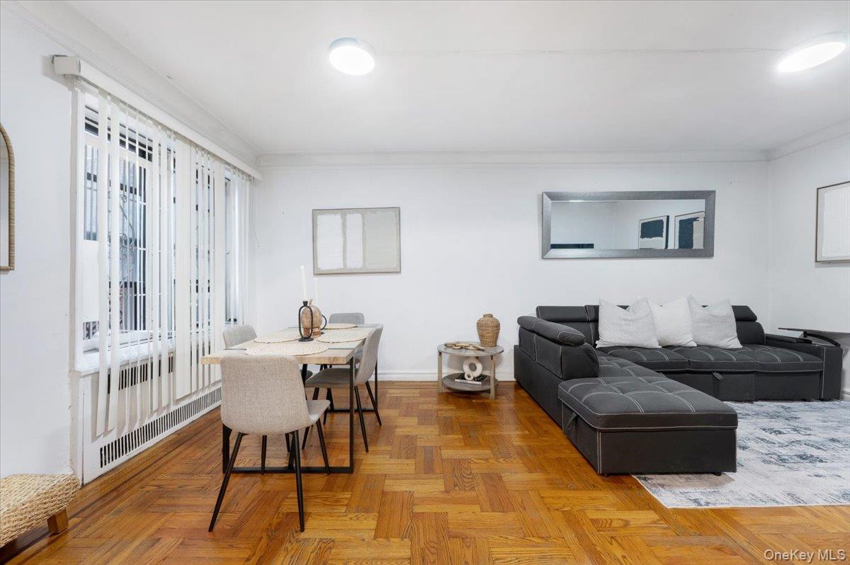 43-01 46th Street, Unit 2A Queens, NY 11104 - Photo 3 of 18 a living room with furniture and a rug