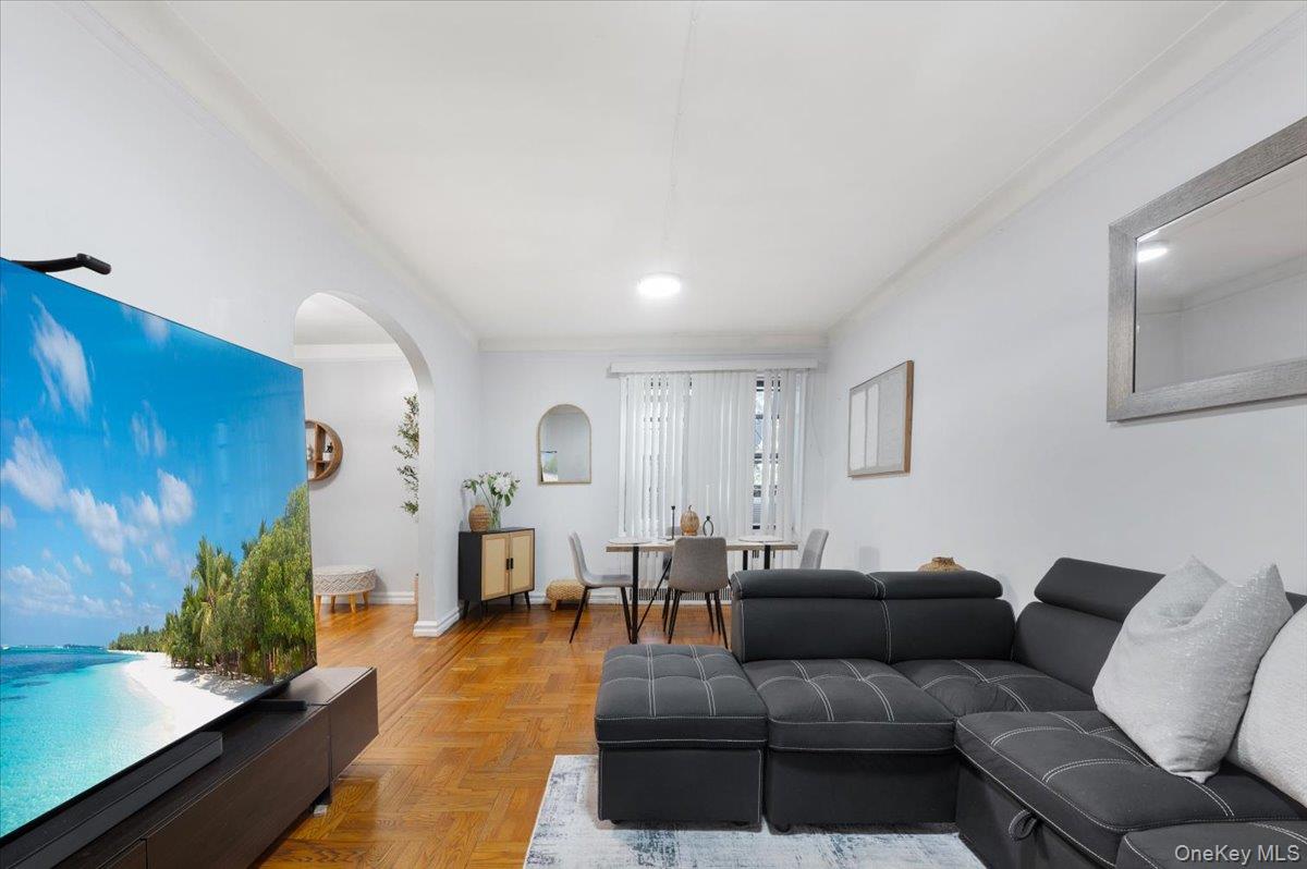 43-01 46th Street, Unit 2A Queens, NY 11104 - Photo 5 of 18 a living room with furniture and a couch