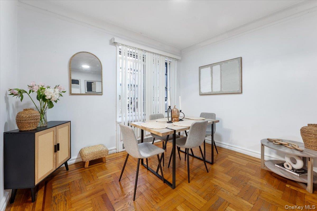 43-01 46th Street, Unit 2A Queens, NY 11104 - Photo 6 of 18 a view of a dining room with furniture and wooden floor