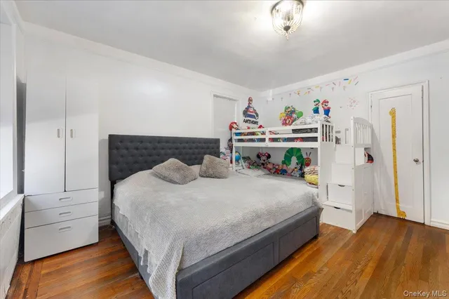 a bedroom with a bed and a ceiling fan