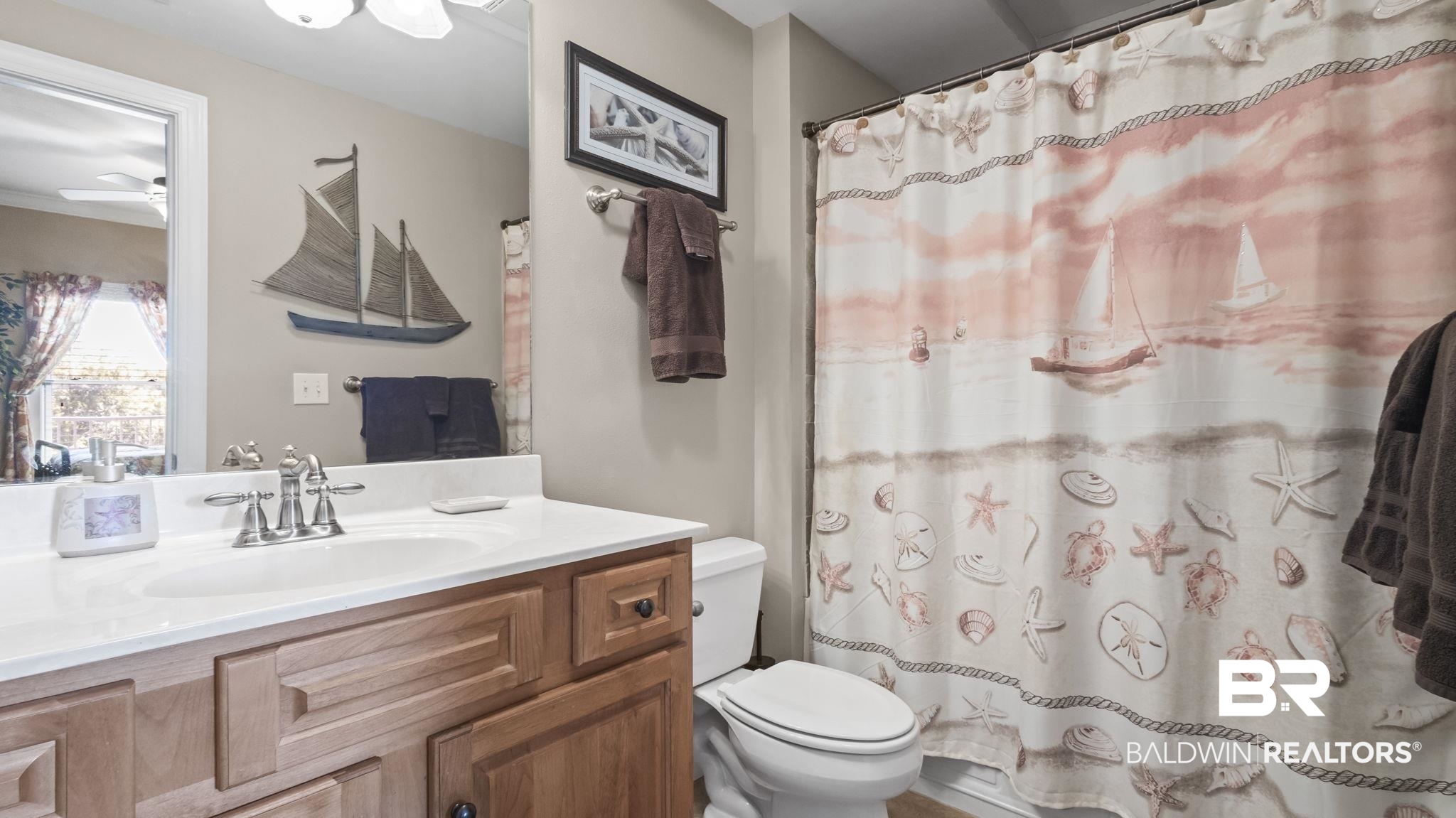 25909 Canal Road, Unit 203 Orange Beach, AL 36561 - Photo 25 of 36 Full bathroom with vanity and curtained shower