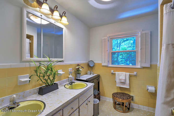 271 Jackson Pines Road Jackson, NJ 08527 - Photo 15 of 26 a bathroom with a granite countertop sink a toilet and a mirror