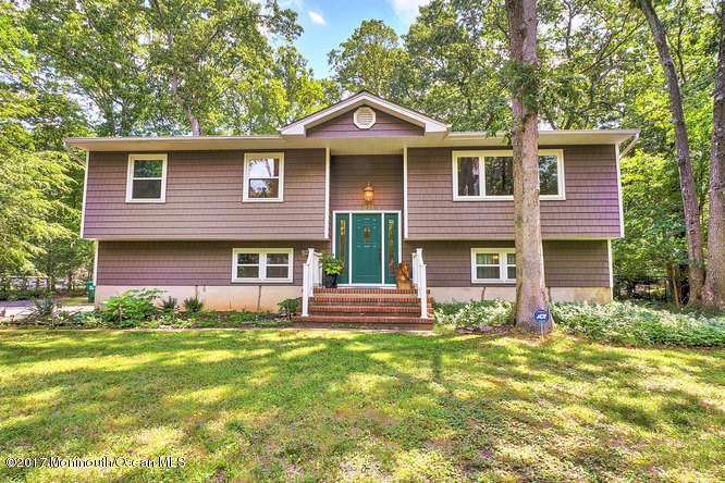 271 Jackson Pines Road Jackson, NJ 08527 - Photo 2 of 26 a front view of a house with garden