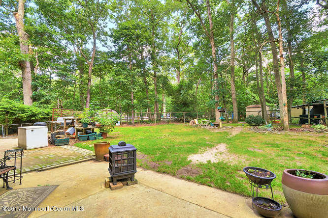 271 Jackson Pines Road Jackson, NJ 08527 - Photo 23 of 26 a view of a backyard with sitting area