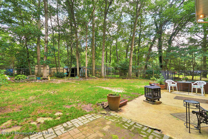 271 Jackson Pines Road Jackson, NJ 08527 - Photo 24 of 26 a view of a backyard with sitting area