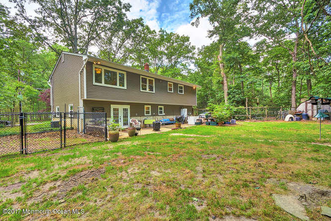 271 Jackson Pines Road Jackson, NJ 08527 - Photo 25 of 26 a view of a house with a yard and sitting area