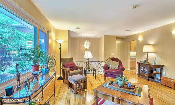 271 Jackson Pines Road Jackson, NJ 08527 - Photo 5 of 26 a living room filled with furniture and a large window