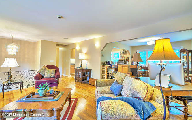 271 Jackson Pines Road Jackson, NJ 08527 - Photo 6 of 26 a living room with furniture and a lamp