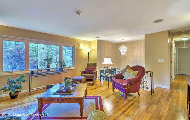 271 Jackson Pines Road Jackson, NJ 08527 - Photo 7 of 26 a living room with furniture and a floor to ceiling window