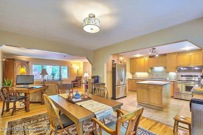 271 Jackson Pines Road Jackson, NJ 08527 - Photo 9 of 26 a view of a dining room with furniture a chandelier and wooden floor
