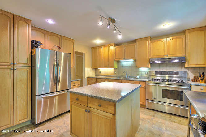 271 Jackson Pines Road Jackson, NJ 08527 - Photo 10 of 26 a kitchen with a refrigerator sink and stove