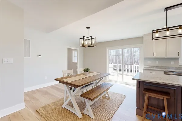 a living room with a table and chairs