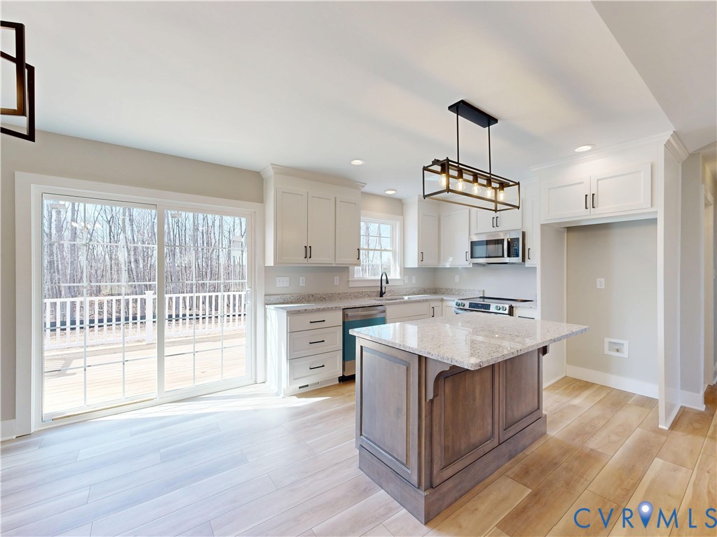 9807 Old Courthouse Road Appomattox, VA 24522 - Photo 7 of 19 Kitchen with white cabinets, stainless steel appli