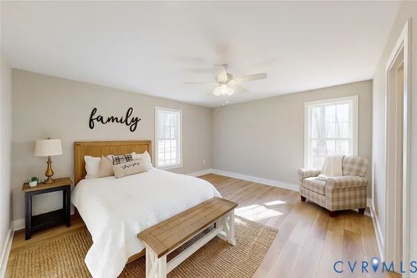 a bedroom with a bed and a couch