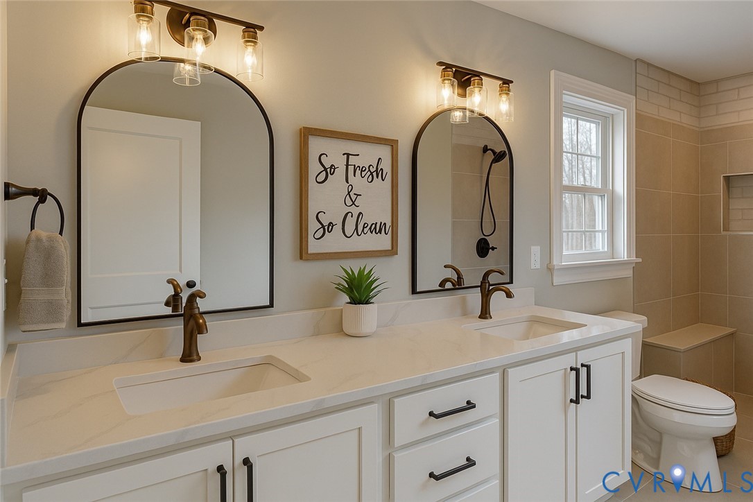 9807 Old Courthouse Road Appomattox, VA 24522 - Photo 9 of 19 Bathroom featuring double vanity, a tile shower, a