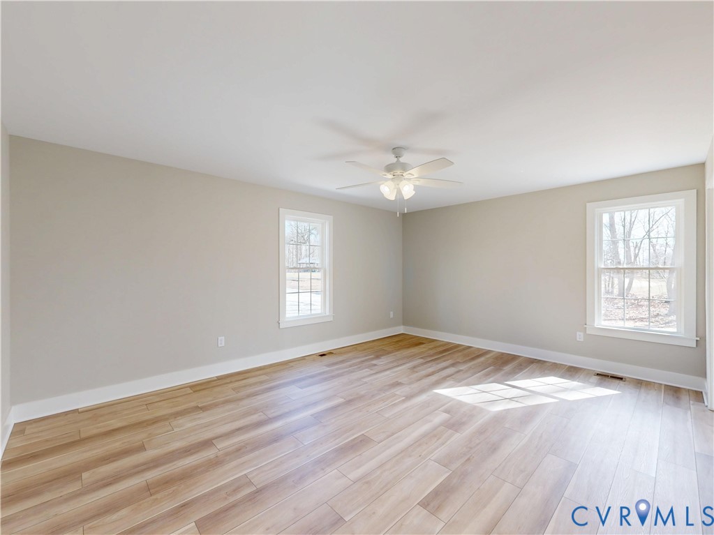 9807 Old Courthouse Road Appomattox, VA 24522 - Photo 10 of 19 Spare room with light wood-style floors and ceilin