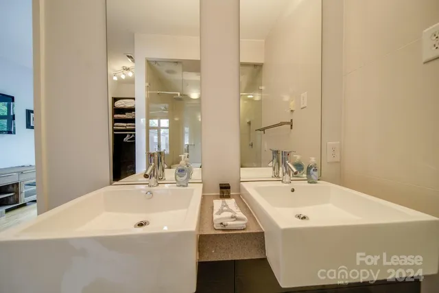 a bathroom with a bathtub and a sink