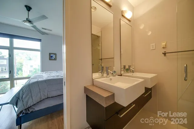 a en suite bathroom with a sink and a mirror