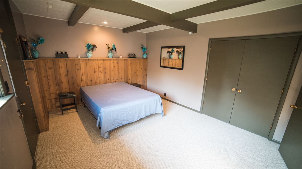 3802 Brookview Road Rockford, IL 61107 - Photo 18 of 25 a bedroom with a bed and a mirror